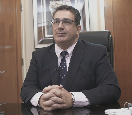 Dr. John F. Como